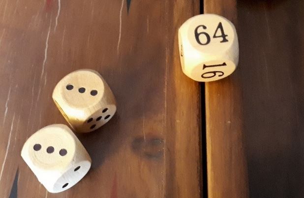 Backgammon doubling cube with standard dice.